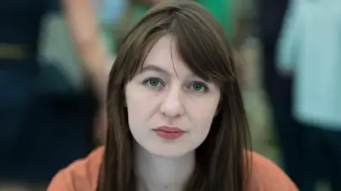 Irish author Sally Rooney claims she will not travel to the UK due to arrest fears